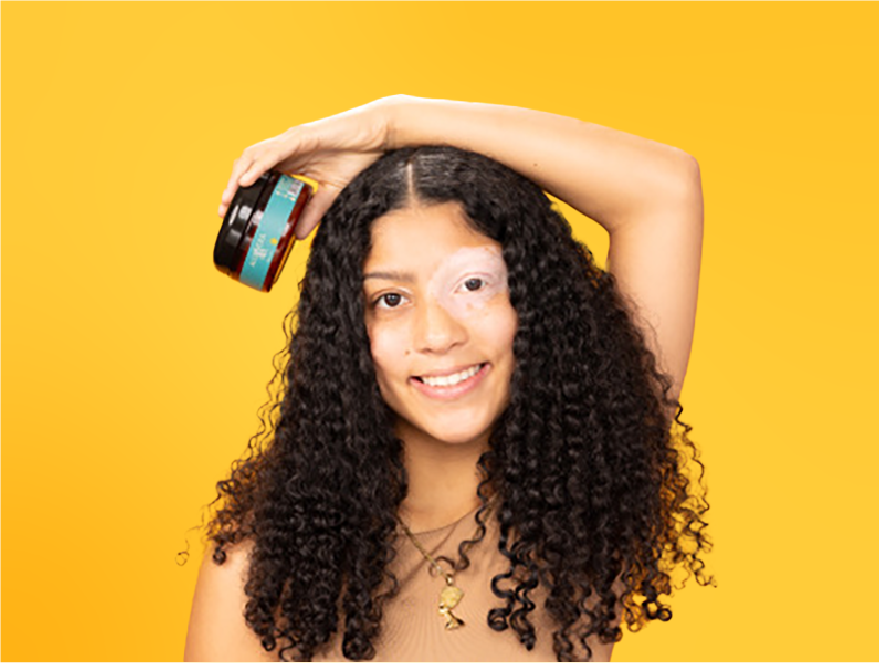Natural Butter Bar, model holding product against a yellow background